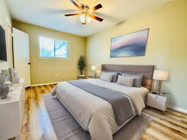 1320 Southport Dr, Austin, TX 78704 - bedroom with light wood-style flooring, baseboards, and a ceiling fan
