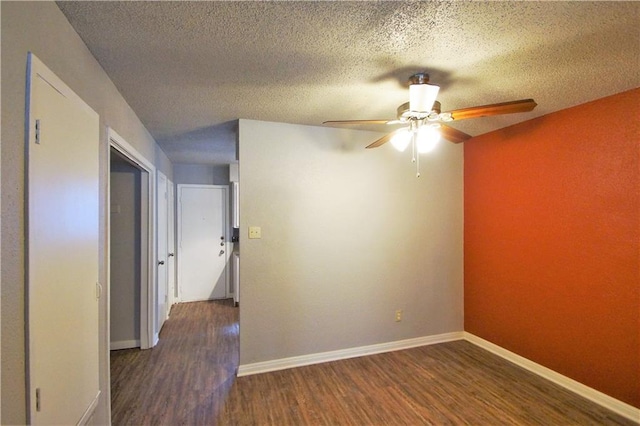 1320 Southport Dr, Austin, TX 78704 - empty room with wood finished floors, ceiling fan, baseboards, and a textured ceiling