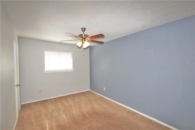 1320 Southport Dr, Austin, TX 78704 - empty room with a ceiling fan, light carpet, baseboards, and a textured ceiling
