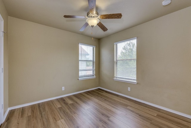 8912 Norwich Castle, Austin, TX 78747 - unfurnished room with wood finished floors, baseboards, ceiling fan, and a smoke detector