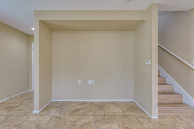 8912 Norwich Castle, Austin, TX 78747 - basement featuring stairway, baseboards, and stone finish floors
