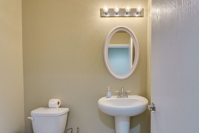 8912 Norwich Castle, Austin, TX 78747 - half bathroom with toilet and a sink