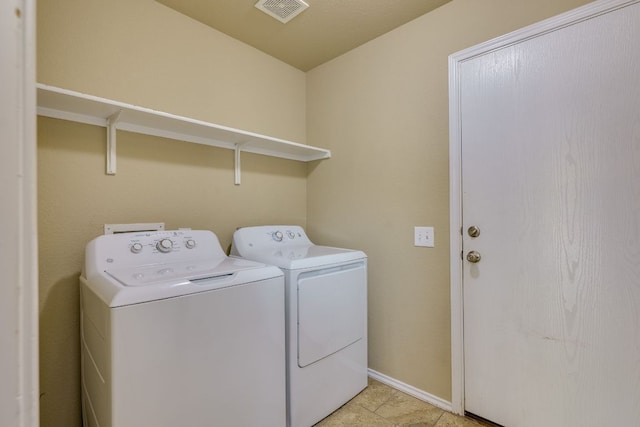 8912 Norwich Castle, Austin, TX 78747 - washroom featuring washing machine and clothes dryer and baseboards