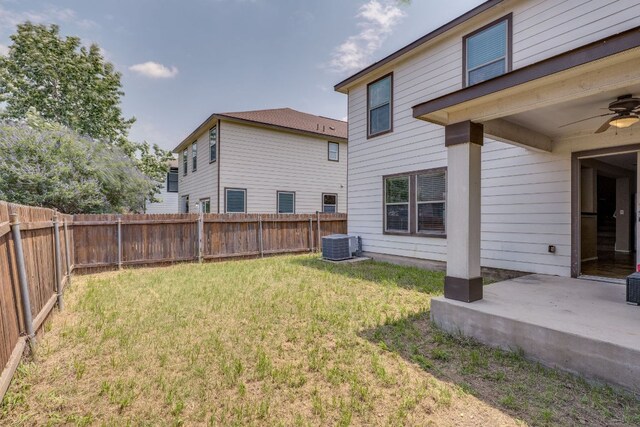 8912 Norwich Castle, Austin, TX 78747 - fenced backyard with ceiling fan and a patio area