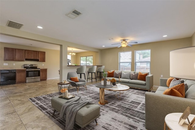 8912 Norwich Castle, Austin, TX 78747 - living area with recessed lighting, ceiling fan, arched walkways, a chandelier, and light tile patterned floors
