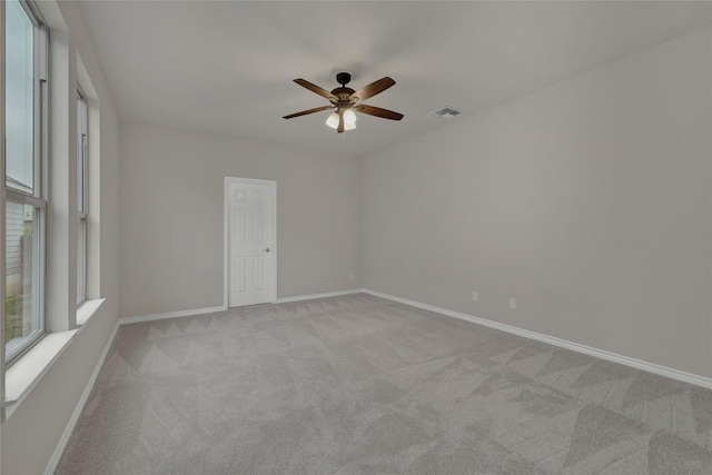2038 Wind Chime Way, New Braunfels, TX 78130 - unfurnished room featuring light carpet, ceiling fan, and baseboards
