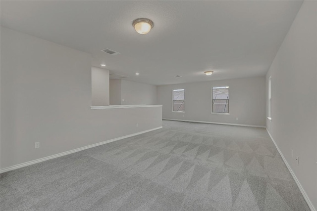 2038 Wind Chime Way, New Braunfels, TX 78130 - spare room with light colored carpet, baseboards, and recessed lighting