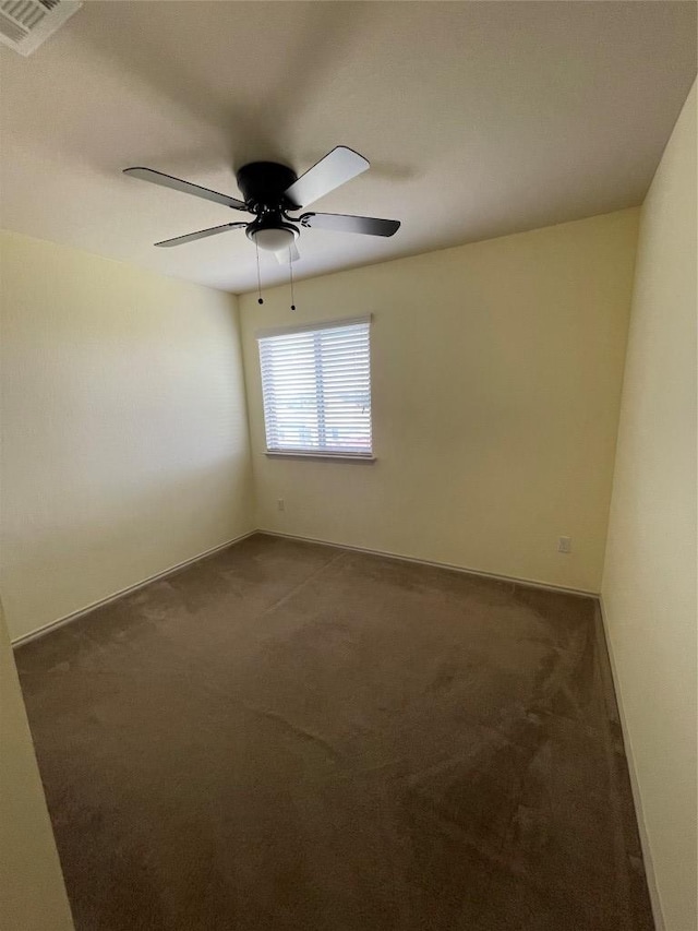 408 Azurite Dr, Jarrell, TX 76537 - empty room with dark carpet, ceiling fan, and baseboards
