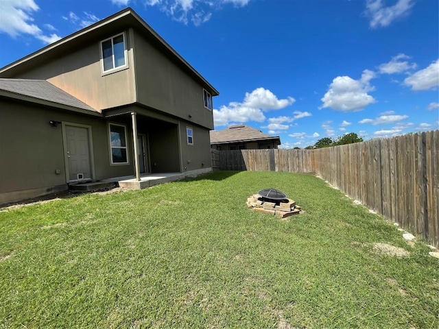 408 Azurite Dr, Jarrell, TX 76537 - back of house featuring a fire pit and a patio area