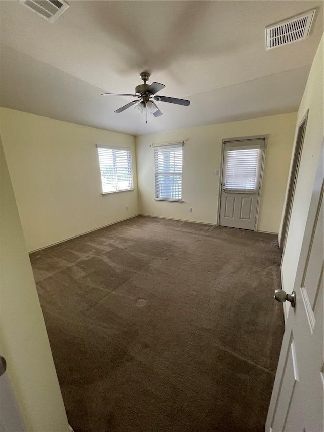 408 Azurite Dr, Jarrell, TX 76537 - unfurnished room featuring dark carpet and ceiling fan