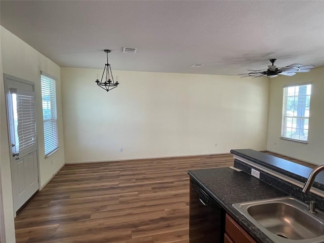 408 Azurite Dr, Jarrell, TX 76537 - kitchen with a sink, dishwasher, dark countertops, and plenty of natural light