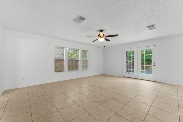 491 Emerald Fields Ln, Kyle, TX 78640 - unfurnished room with a ceiling fan, a textured ceiling, and light tile patterned flooring