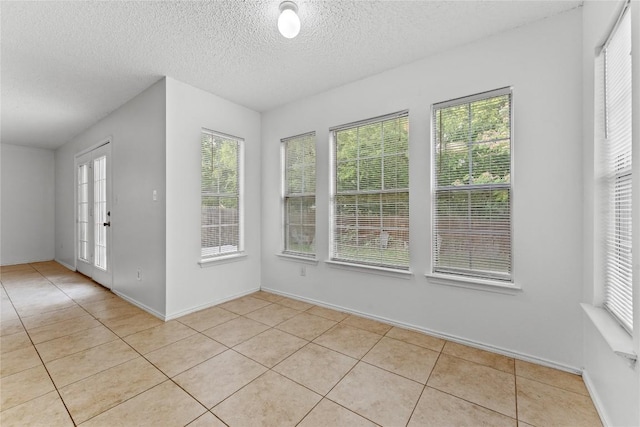 491 Emerald Fields Ln, Kyle, TX 78640 - unfurnished sunroom with healthy amount of natural light and french doors