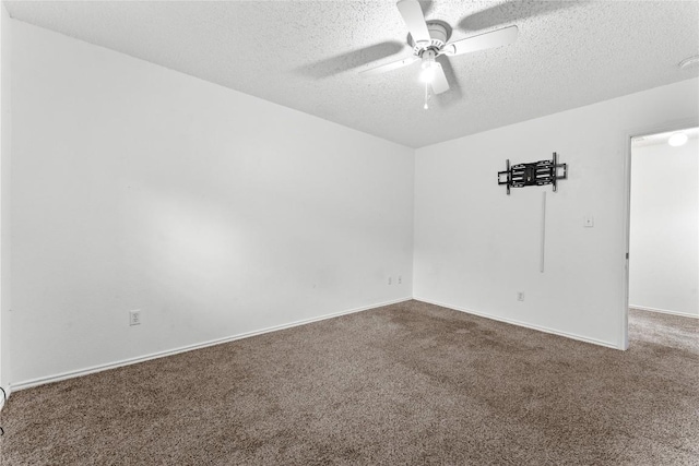 491 Emerald Fields Ln, Kyle, TX 78640 - empty room featuring a textured ceiling, carpet, a ceiling fan, and baseboards