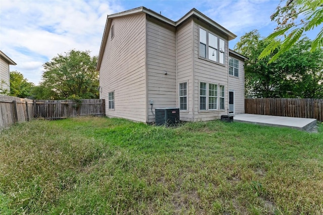 491 Emerald Fields Ln, Kyle, TX 78640 - back of property featuring a patio area and central air condition unit