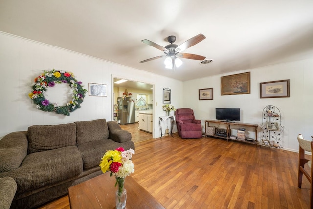 704 6th St, Blanco, TX 78606 - living area with wood-type flooring and ceiling fan