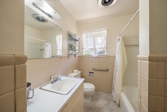 704 6th St, Blanco, TX 78606 - full bathroom with toilet, tile walls, shower / bath combo, and vanity
