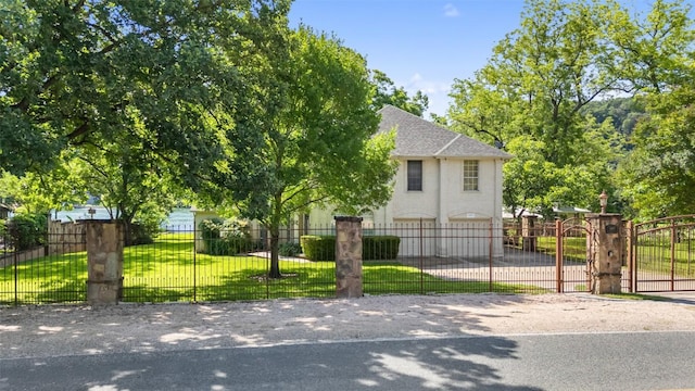 2603 Pearce Rd, Austin, TX 78730 - view of front of property featuring roof with shingles, a gate, driveway, and a garage