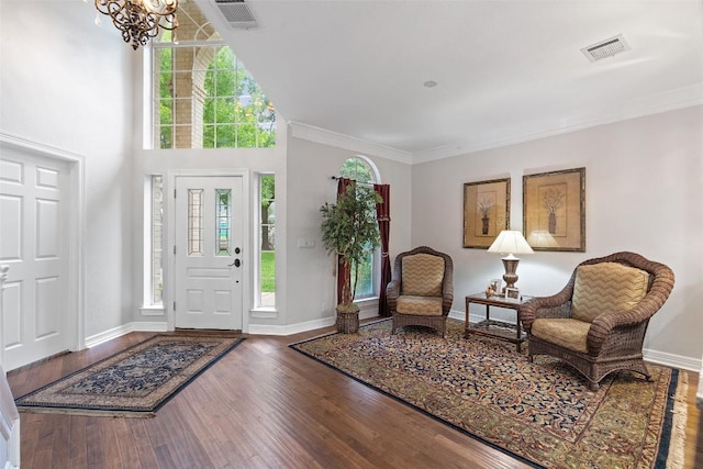 2603 Pearce Rd, Austin, TX 78730 - entryway with wood finished floors, a chandelier, plenty of natural light, baseboards, and ornamental molding