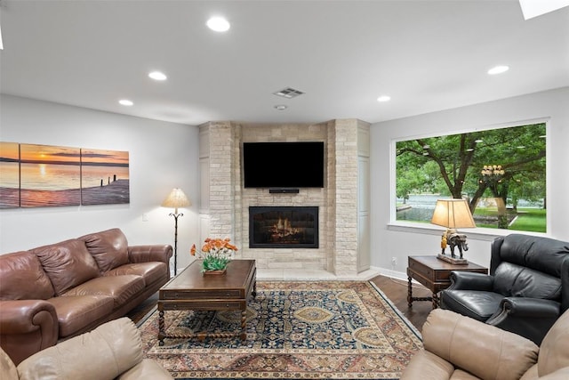 2603 Pearce Rd, Austin, TX 78730 - living area featuring recessed lighting, wood finished floors, a fireplace, and baseboards