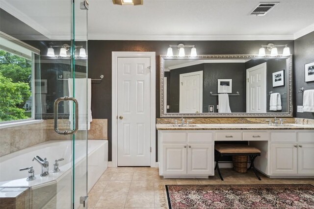 2603 Pearce Rd, Austin, TX 78730 - bathroom featuring a garden tub, double vanity, crown molding, tile patterned flooring, and a shower stall