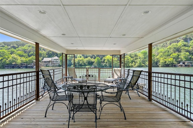 2603 Pearce Rd, Austin, TX 78730 - deck featuring a water view, outdoor dining area, and view of scattered trees