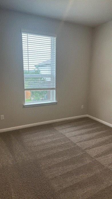 1020 Vista View Dr Unit 2001, Georgetown, TX 78626 - carpeted empty room featuring baseboards