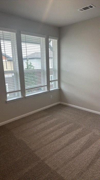 1020 Vista View Dr Unit 2001, Georgetown, TX 78626 - spare room featuring baseboards and plenty of natural light