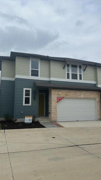 1020 Vista View Dr Unit 2001, Georgetown, TX 78626 - view of front of home with an attached garage and driveway