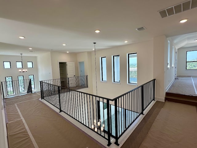 104 High View Trl, Lakeway, TX 78738 - hallway with recessed lighting and a chandelier