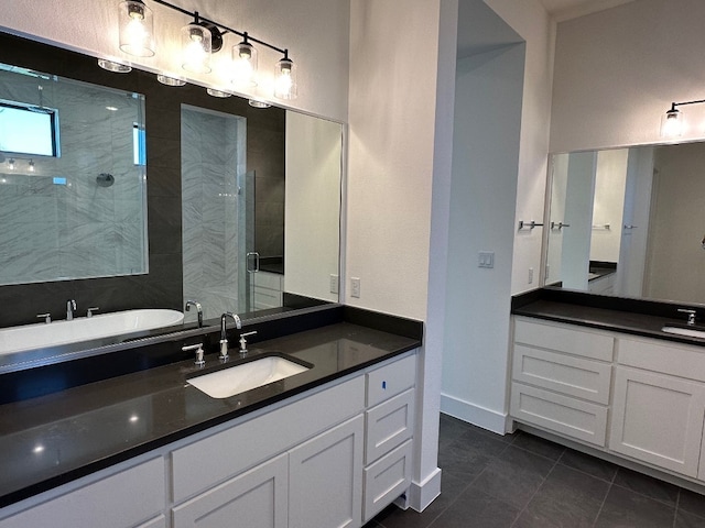 104 High View Trl, Lakeway, TX 78738 - full bathroom featuring tile patterned floors, two vanities, a stall shower, and a tub
