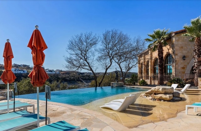 104 High View Trl, Lakeway, TX 78738 - view of pool with a patio area and an infinity pool