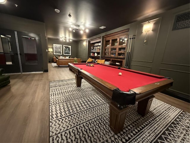 4510 Terry-O Ln Unit 108, Austin, TX 78745 - playroom featuring billiards table, light wood-style floors, and a decorative wall