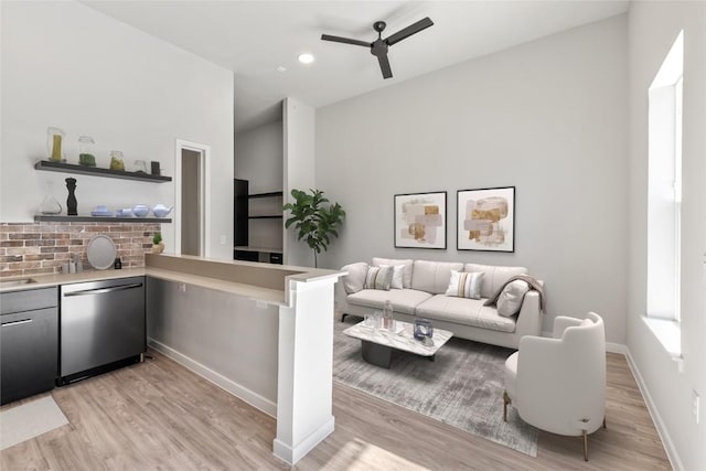 4510 Terry-O Ln Unit 108, Austin, TX 78745 - living room with light wood finished floors, a ceiling fan, and baseboards