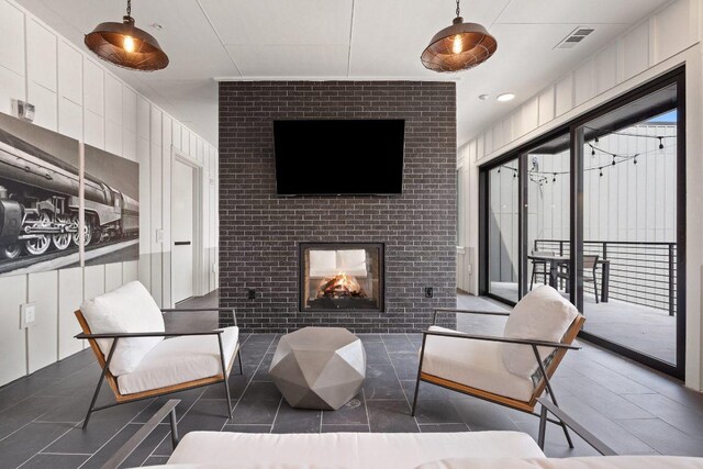 4510 Terry-O Ln Unit 108, Austin, TX 78745 - living area featuring a brick fireplace and tile patterned floors