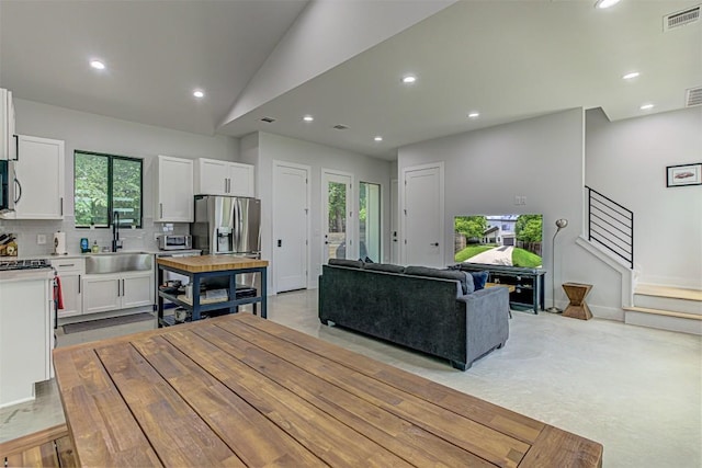 600 Blackson Ave Unit 2, Austin, TX 78752 - living room featuring recessed lighting and lofted ceiling