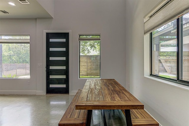 600 Blackson Ave Unit 2, Austin, TX 78752 - unfurnished dining area featuring healthy amount of natural light, finished concrete flooring, and baseboards