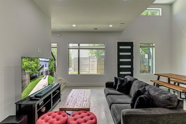 600 Blackson Ave Unit 2, Austin, TX 78752 - carpeted living area with baseboards and recessed lighting