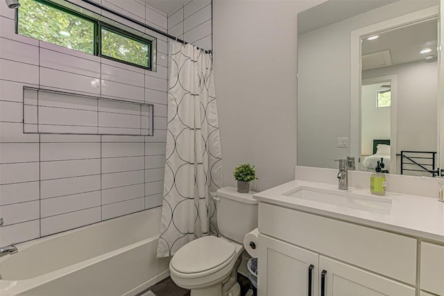 600 Blackson Ave Unit 2, Austin, TX 78752 - full bath featuring plenty of natural light, toilet, vanity, and shower / tub combo with curtain