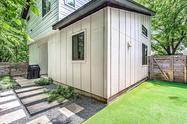 600 Blackson Ave Unit 2, Austin, TX 78752 - view of side of home with board and batten siding and a gate