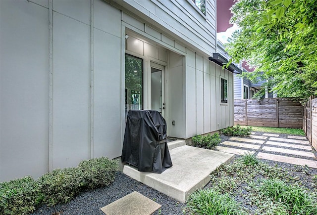 600 Blackson Ave Unit 2, Austin, TX 78752 - doorway to property featuring board and batten siding and a patio area