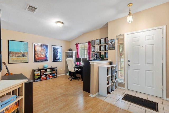 4125 Licorice Ln, Austin, TX 78728 - entrance foyer featuring vaulted ceiling and light wood-style floors