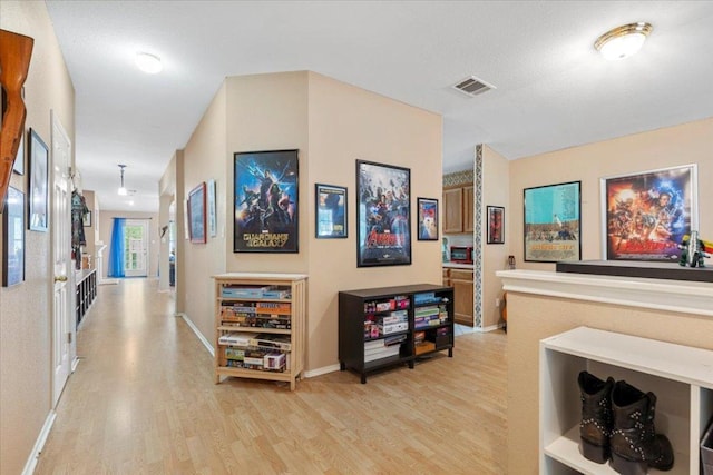 4125 Licorice Ln, Austin, TX 78728 - hall with light wood-style flooring and baseboards