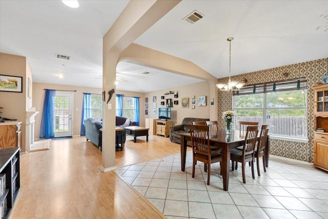 4125 Licorice Ln, Austin, TX 78728 - dining space with a chandelier, light wood-type flooring, lofted ceiling, and baseboards