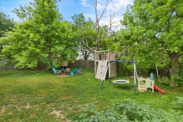 4125 Licorice Ln, Austin, TX 78728 - fenced backyard featuring a playground and an outdoor fire pit