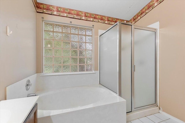 4125 Licorice Ln, Austin, TX 78728 - full bath featuring a shower stall, a bath, vanity, and tile patterned flooring