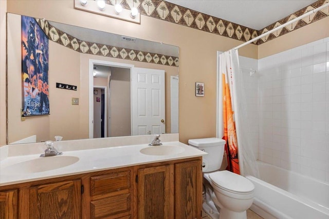 4125 Licorice Ln, Austin, TX 78728 - full bathroom featuring toilet, shower / bath combination with curtain, and double vanity