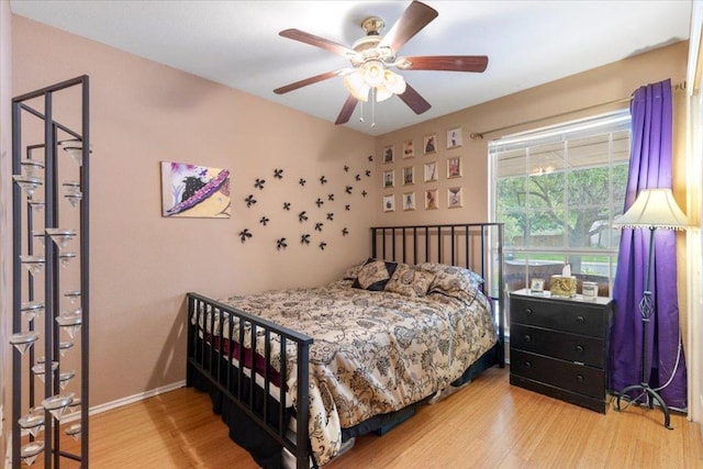 4125 Licorice Ln, Austin, TX 78728 - bedroom with wood finished floors, baseboards, and a ceiling fan