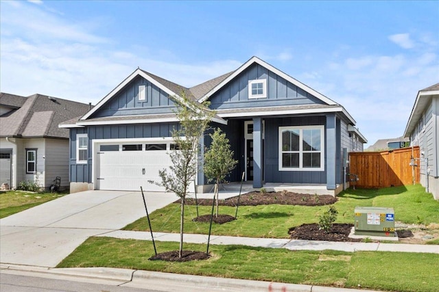 240 Camino Verde Dr, San Marcos, TX 78666 - view of front facade featuring board and batten siding, a garage, and driveway