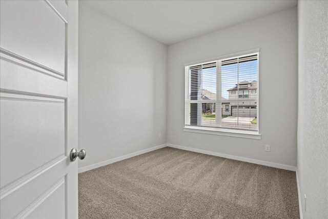 240 Camino Verde Dr, San Marcos, TX 78666 - carpeted empty room with baseboards